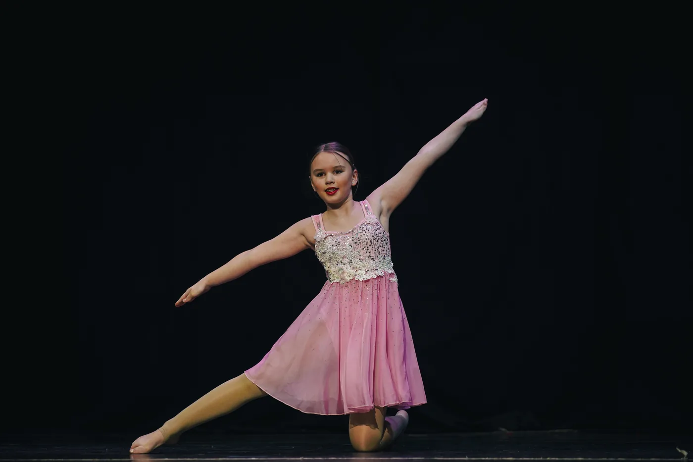 A dancer holding a graceful arabesque