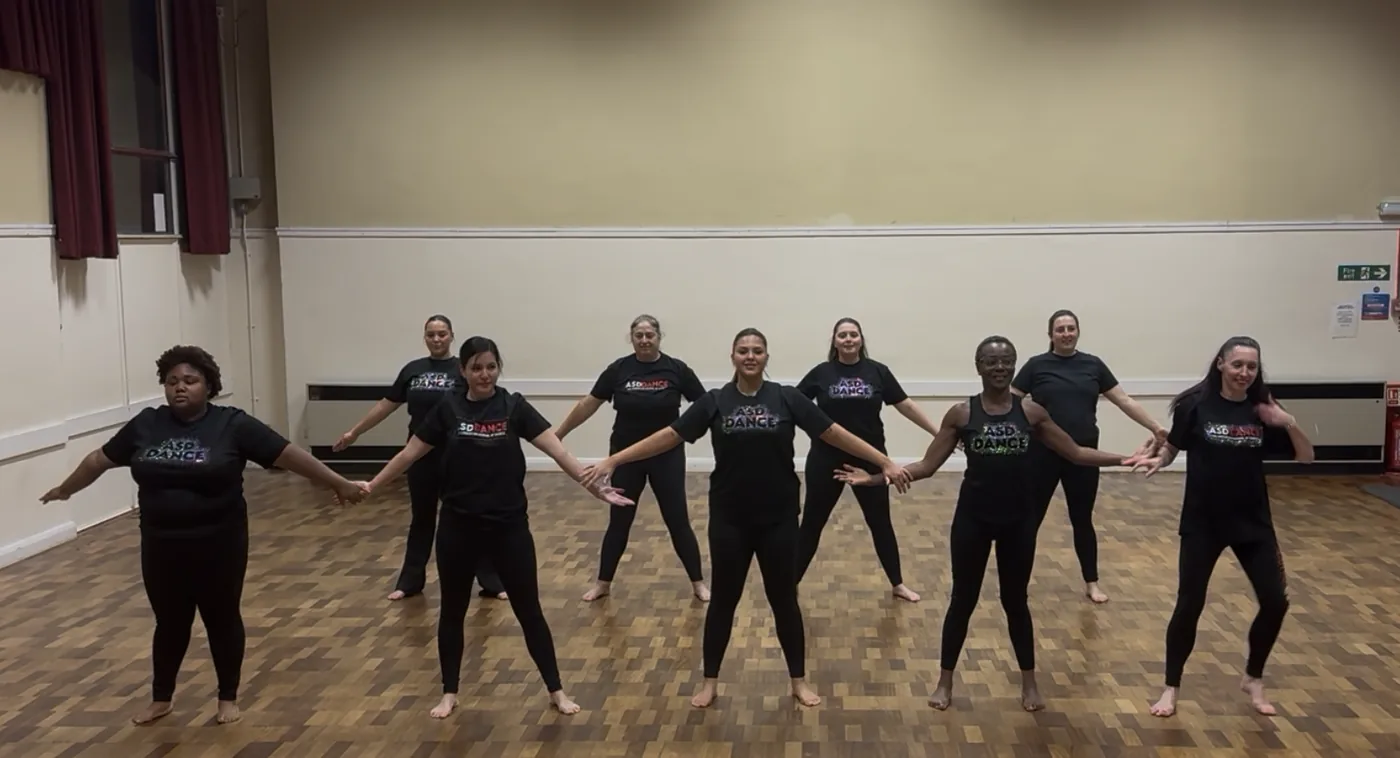 Dancers working through a routine in the studio