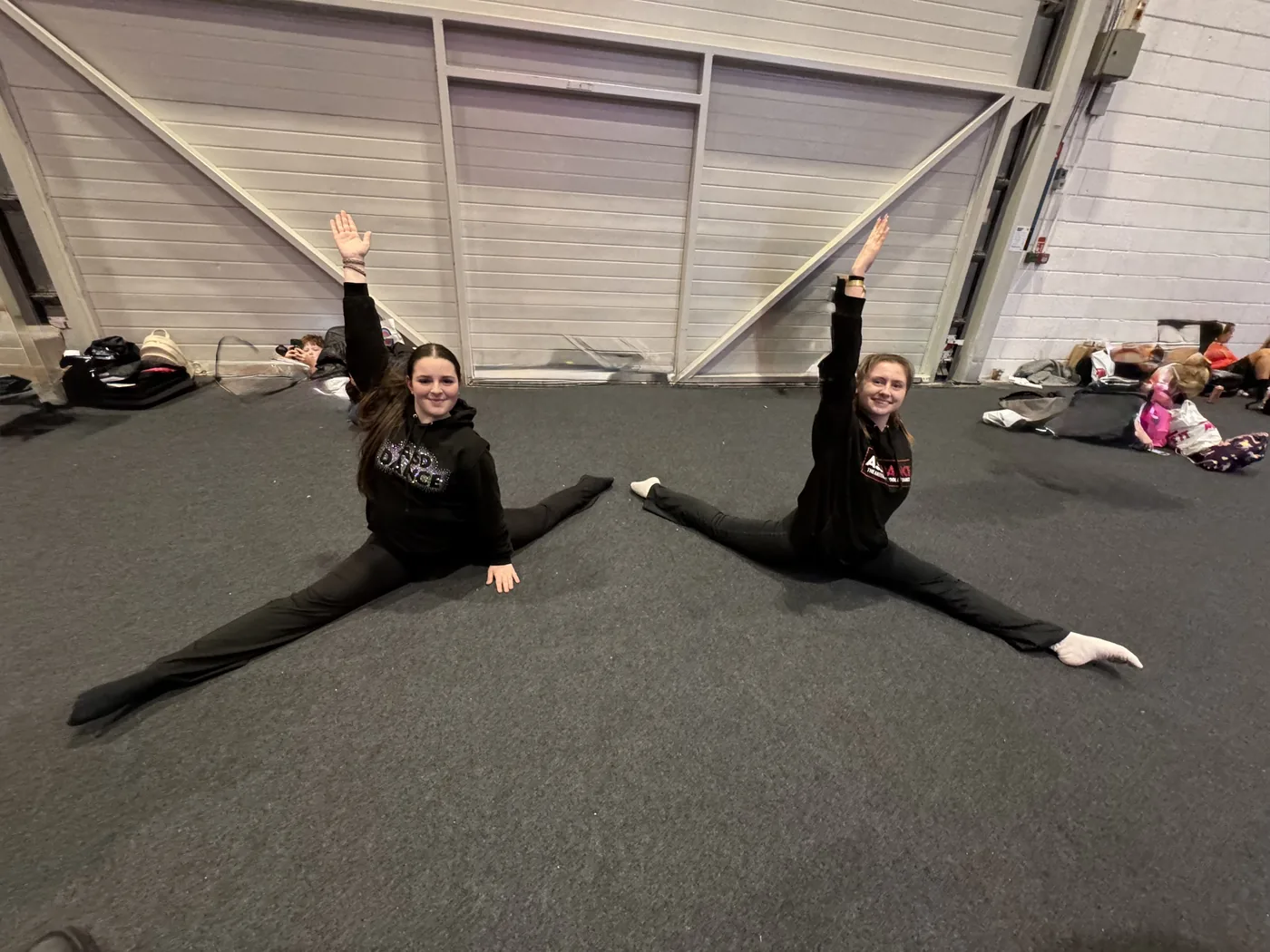 Students stretching and building strength in class
