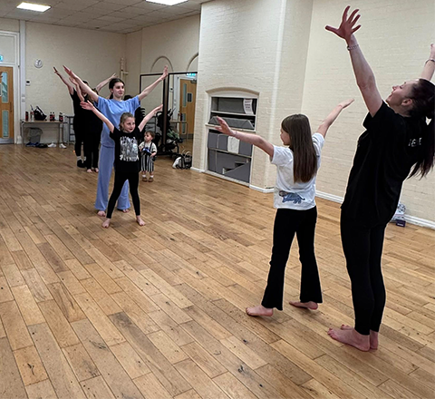 A full mixed-age class in session