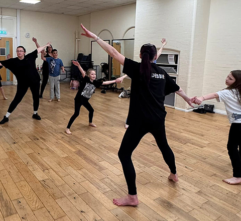 Students mid-movement in the studio